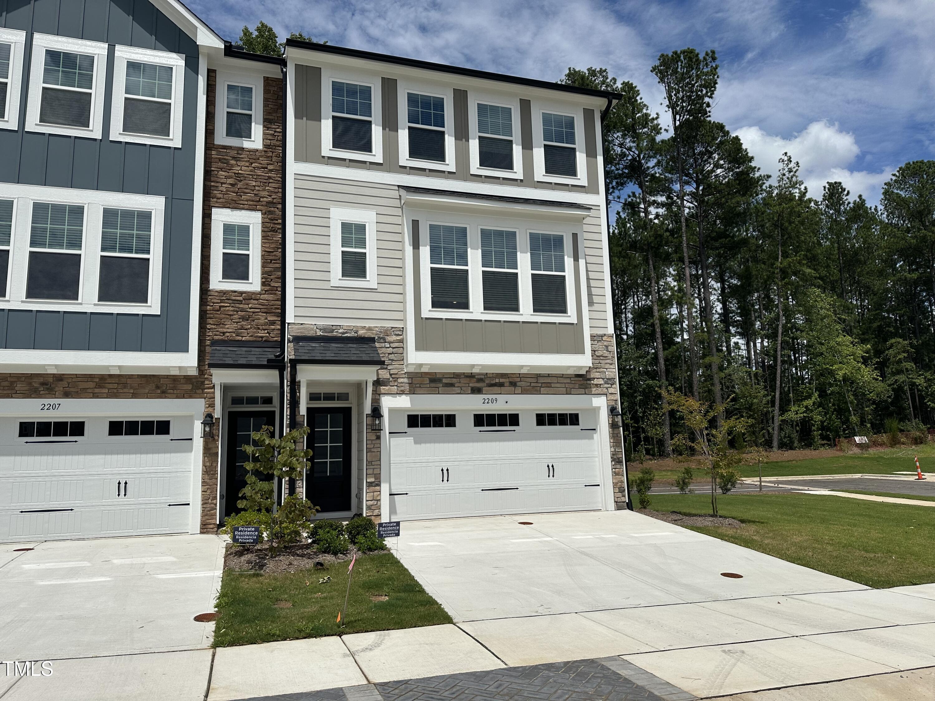 2209 Lambert Road Cary, NC 27519 - Photo 51 of 51 a front view of a house with a yard