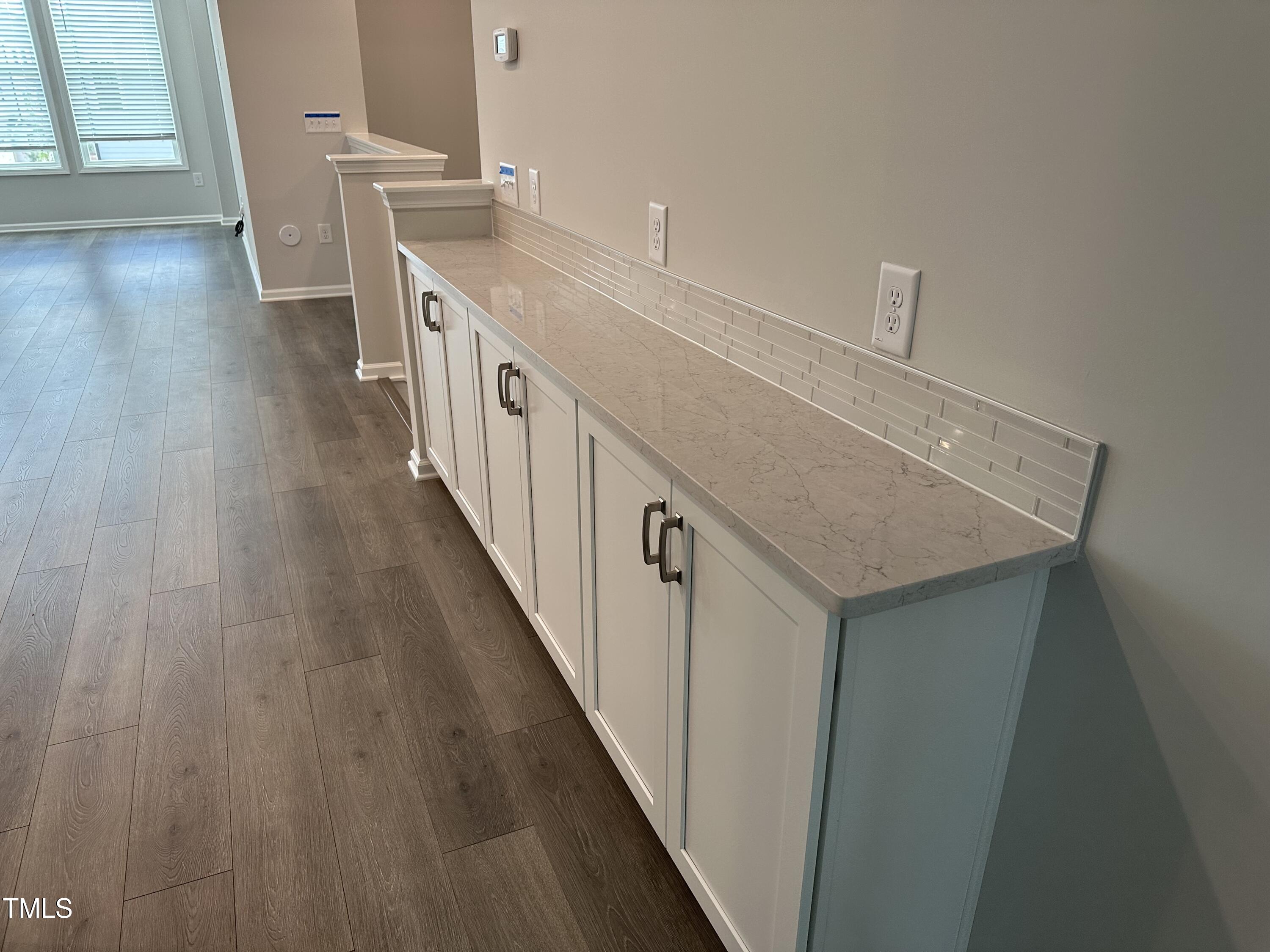 2209 Lambert Road Cary, NC 27519 - Photo 10 of 51 a view of a kitchen from a hallway