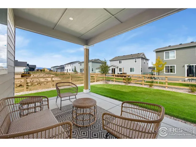 a view of a patio with a table chairs and a patio