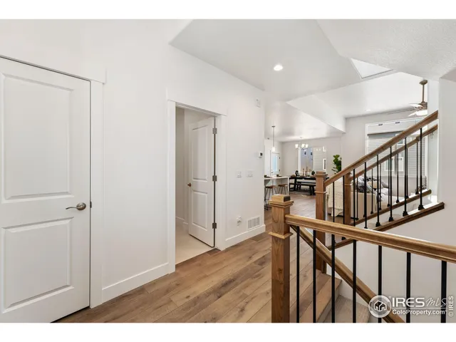 a view of an entryway with wooden floor