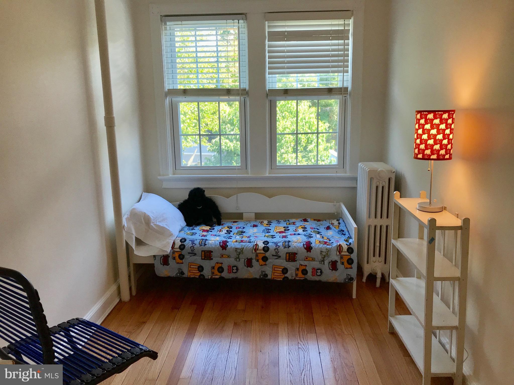 4436 Reservoir Road Northwest Washington, DC 20007 - Photo 22 of 28 Bedroom 3, nice light, hardwood floors