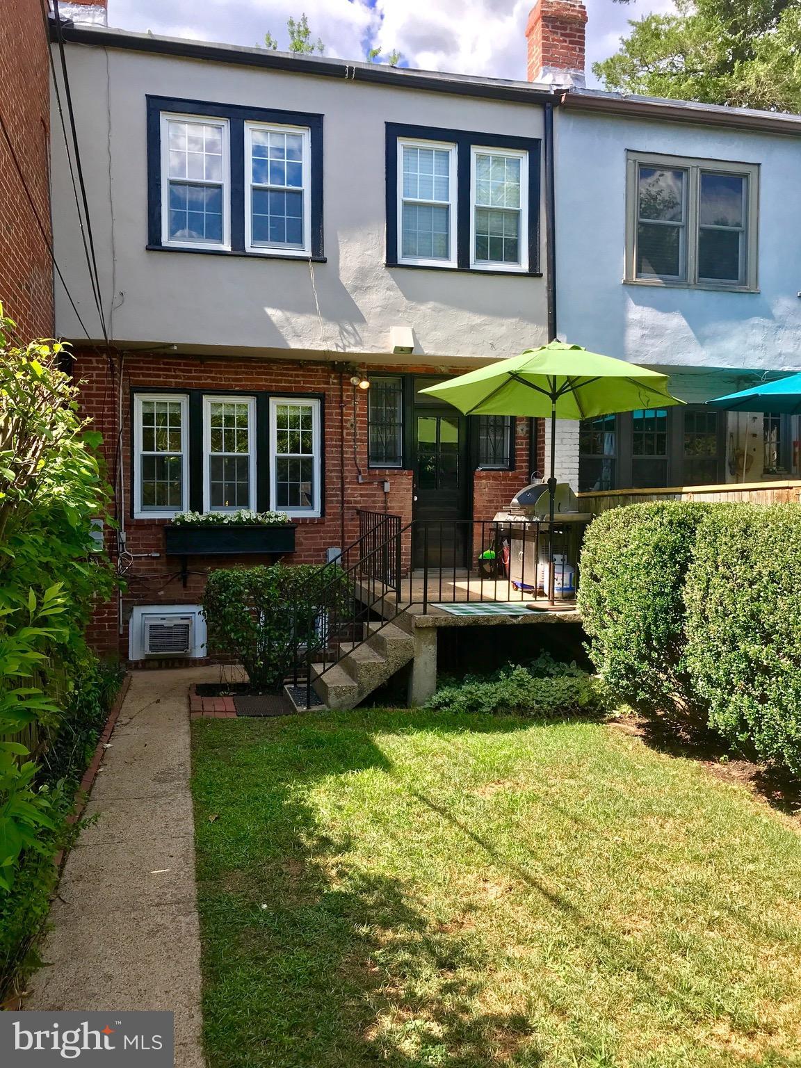 4436 Reservoir Road Northwest Washington, DC 20007 - Photo 25 of 28 Backyard with deck, lawn private garage