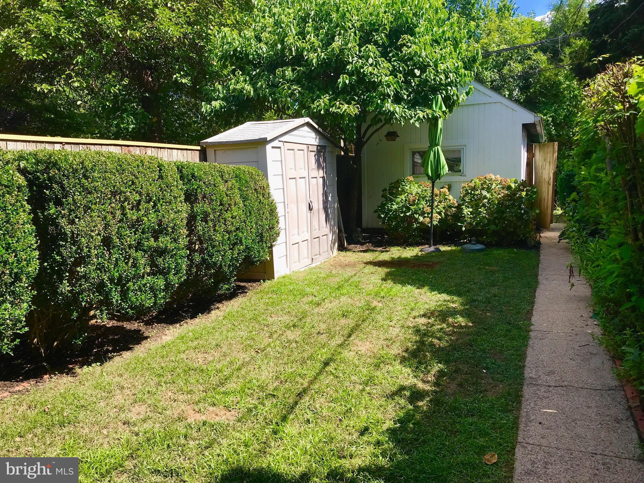 4436 Reservoir Road Northwest Washington, DC 20007 - Photo 27 of 28 Beautiful backyard with lovely landscape, garage