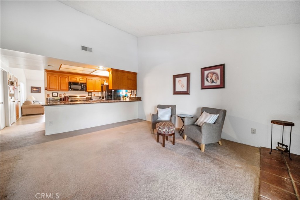 6275 Sapphire Street Rancho Cucamonga, CA 91701 - Photo 14 of 32 a living room with couches and kitchen view with wooden floor