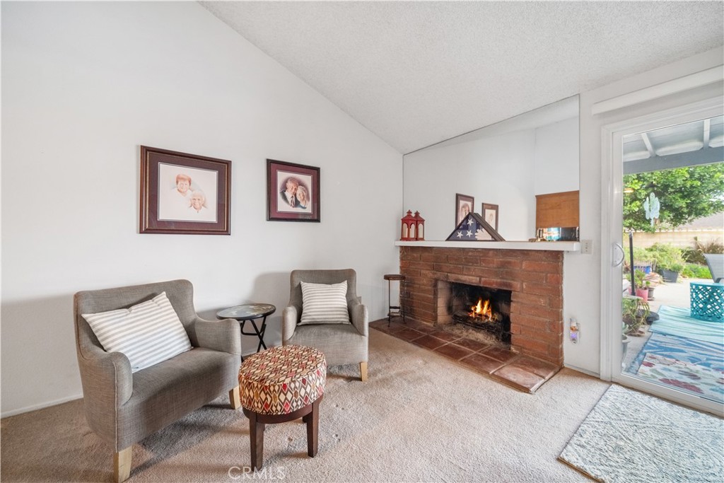 6275 Sapphire Street Rancho Cucamonga, CA 91701 - Photo 15 of 32 a living room with furniture and a fireplace