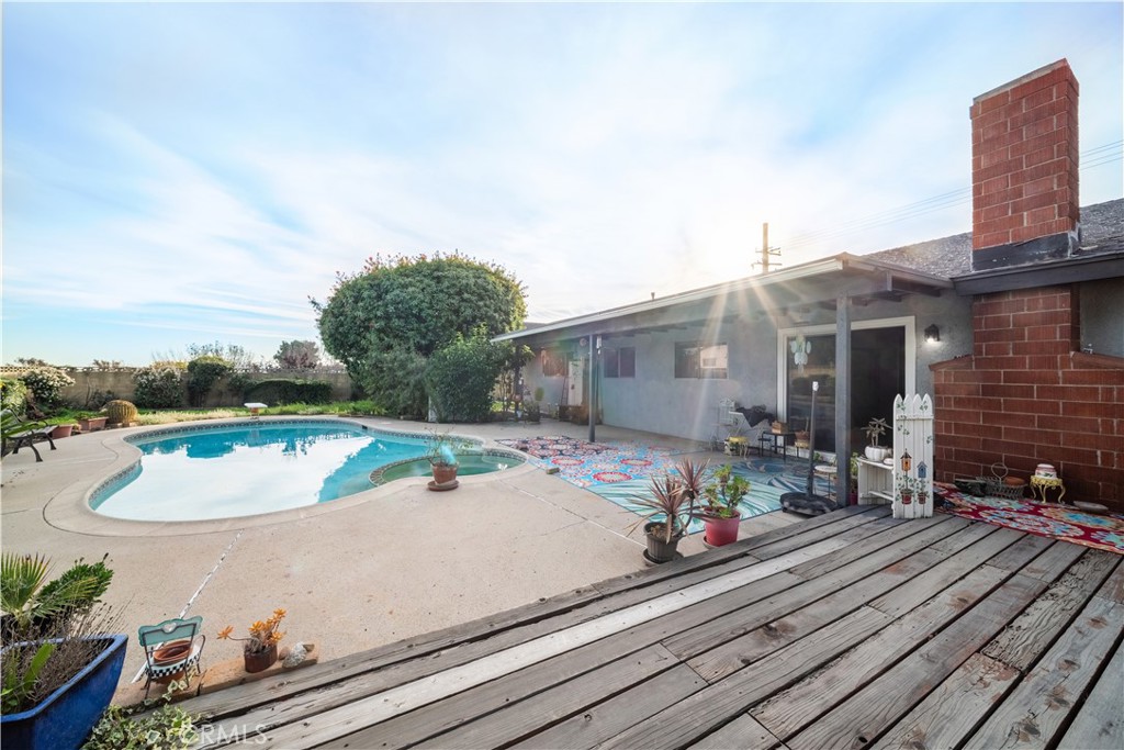 6275 Sapphire Street Rancho Cucamonga, CA 91701 - Photo 17 of 32 a view of a house with pool and chairs