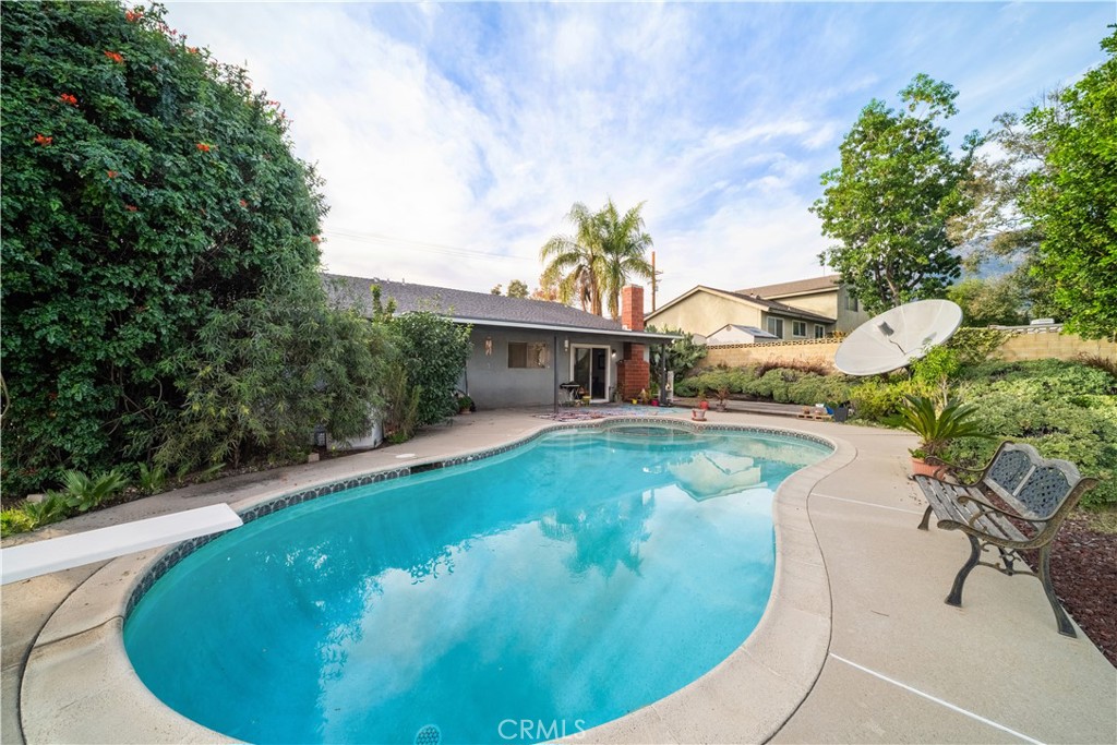 6275 Sapphire Street Rancho Cucamonga, CA 91701 - Photo 18 of 32 a view of a swimming pool with a yard