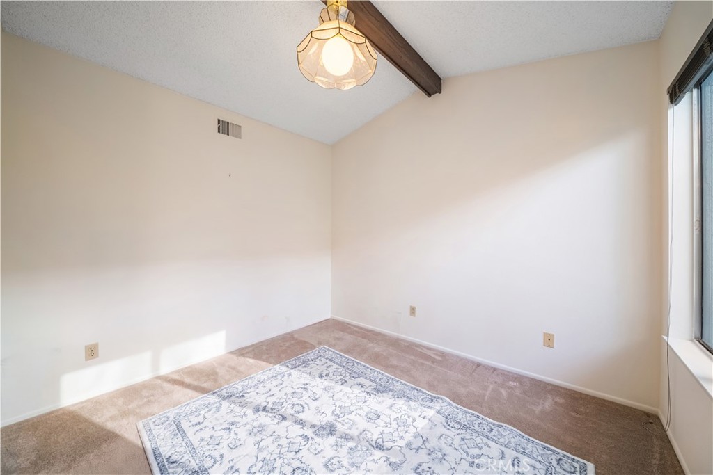 6275 Sapphire Street Rancho Cucamonga, CA 91701 - Photo 20 of 32 a view of a room with a empty space and a window