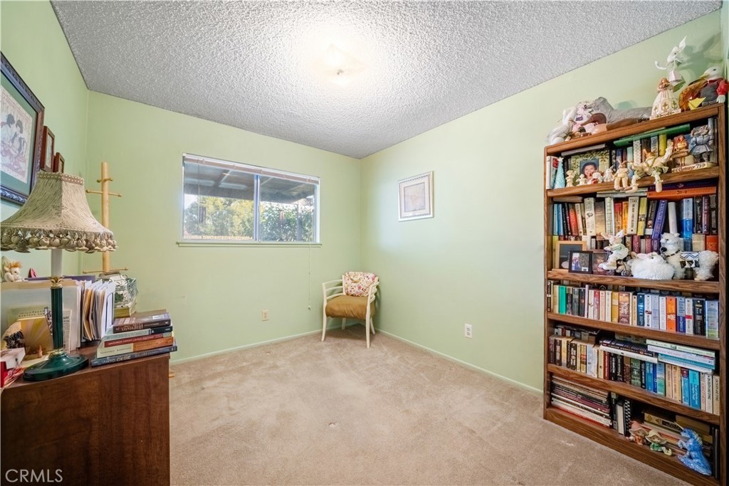6275 Sapphire Street Rancho Cucamonga, CA 91701 - Photo 23 of 32 a view of a workspace with bookshelf