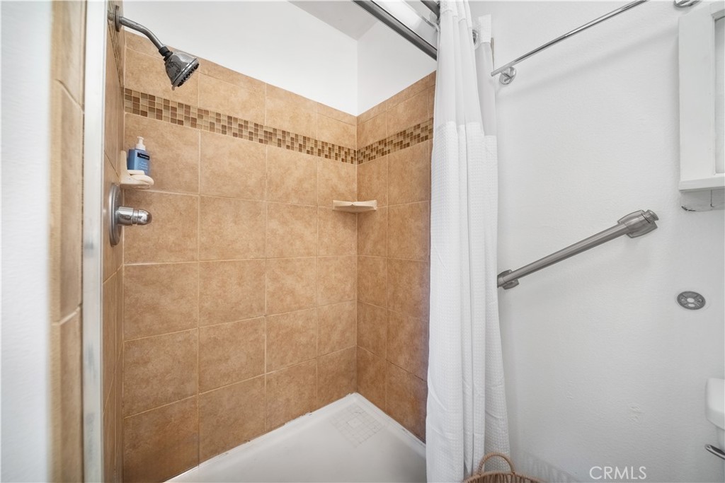 6275 Sapphire Street Rancho Cucamonga, CA 91701 - Photo 28 of 32 a bathroom with a shower