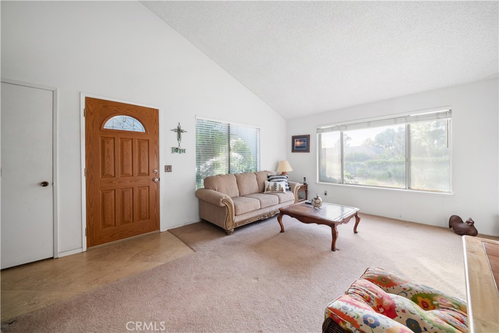 6275 Sapphire Street Rancho Cucamonga, CA 91701 - Photo 9 of 32 a living room with furniture and a window