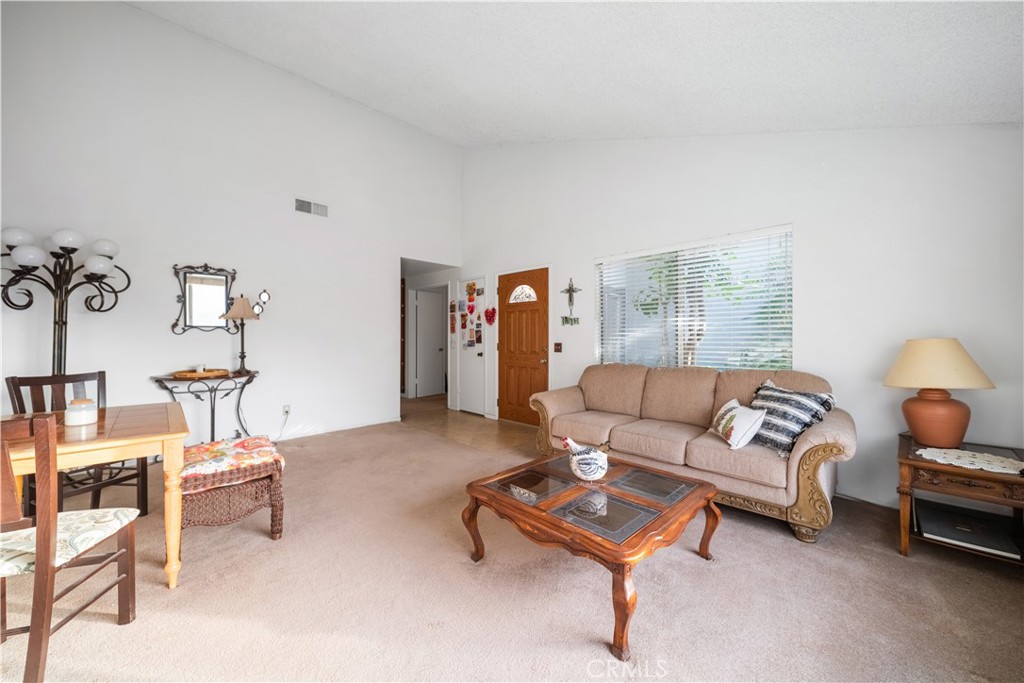 6275 Sapphire Street Rancho Cucamonga, CA 91701 - Photo 10 of 32 a living room with furniture and a potted plant