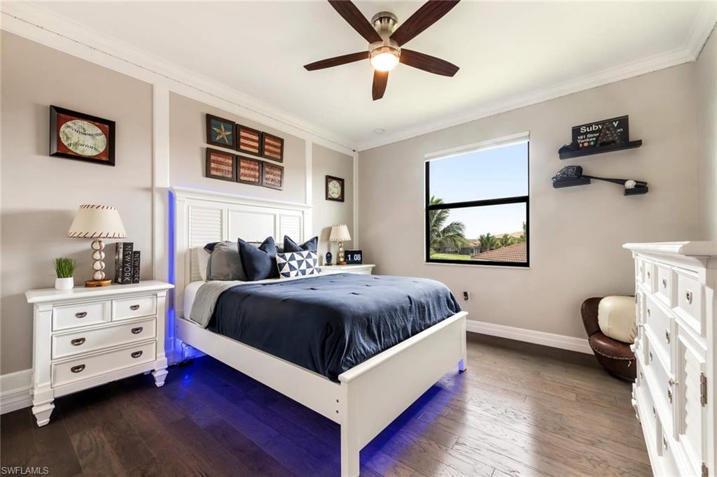 4347 Avalon Court Naples, FL 34119 - Photo 12 of 22 a spacious bedroom with a bed and a window