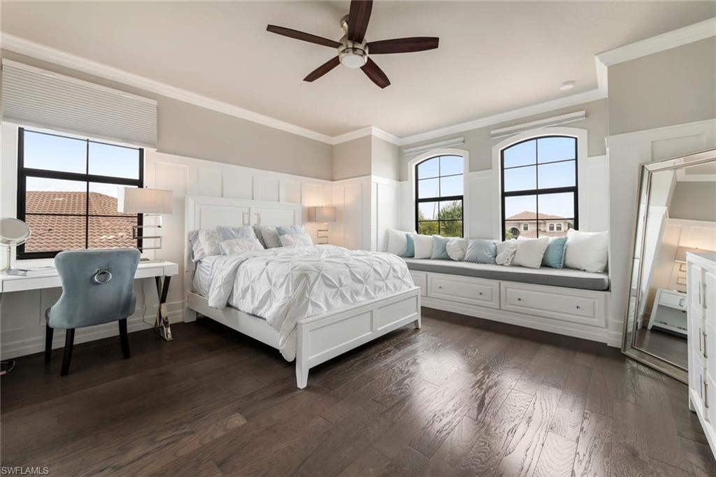 4347 Avalon Court Naples, FL 34119 - Photo 14 of 22 a bedroom with a bed and wooden floor