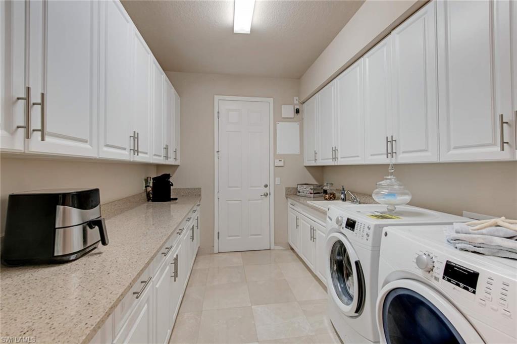 4347 Avalon Court Naples, FL 34119 - Photo 20 of 22 a view of a kitchen with sink and washing machine