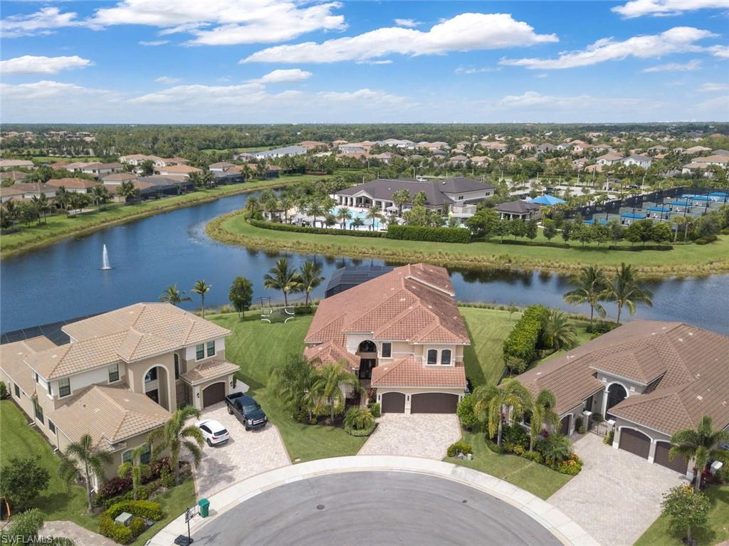 4347 Avalon Court Naples, FL 34119 - Photo 21 of 22 an aerial view of a house with a lake view