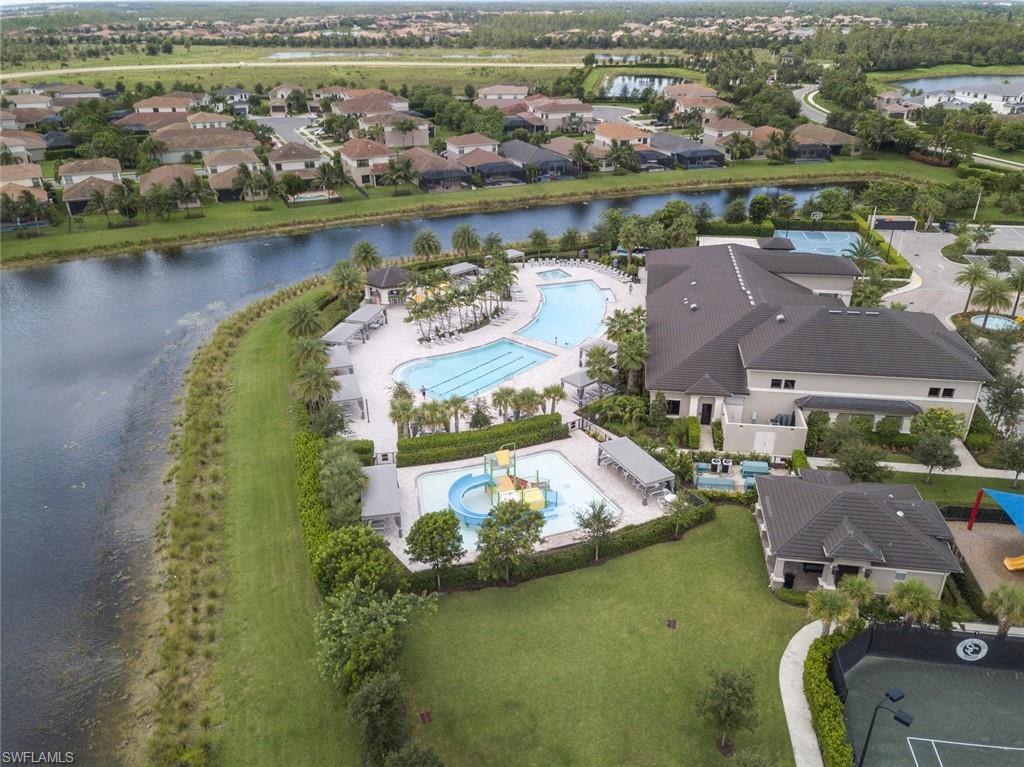 4347 Avalon Court Naples, FL 34119 - Photo 22 of 22 an aerial view of residential houses with outdoor space and lake view