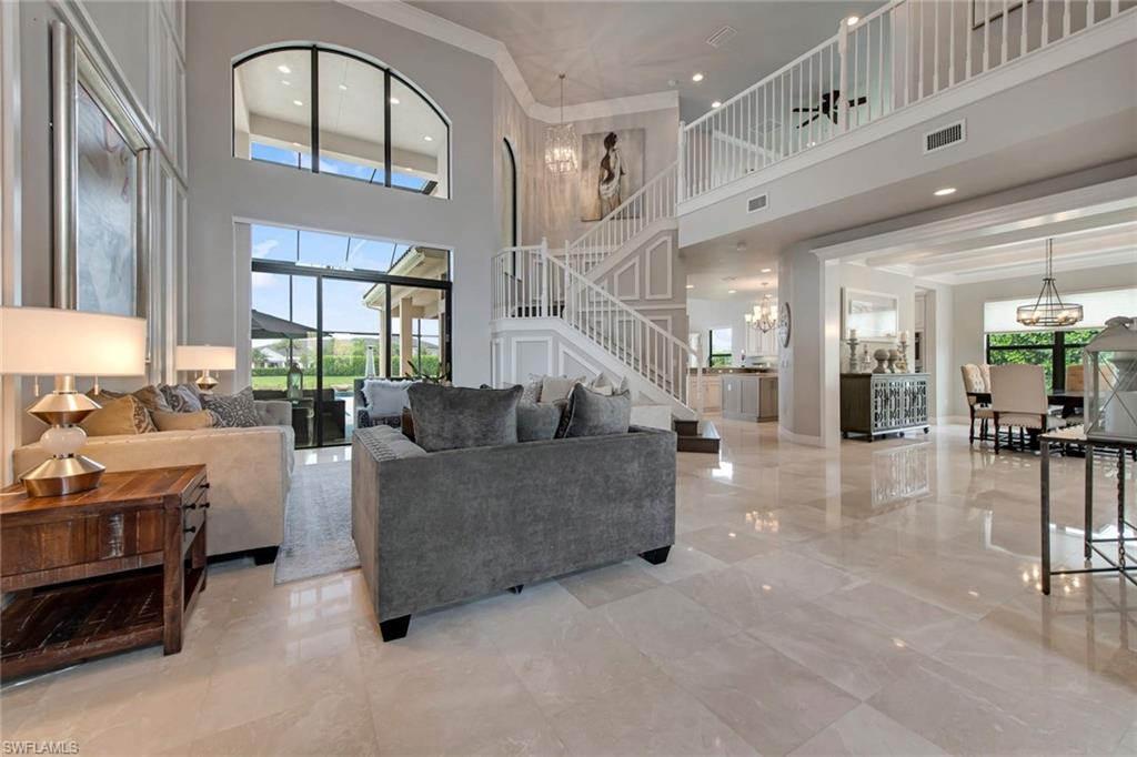 4347 Avalon Court Naples, FL 34119 - Photo 3 of 22 a living room with furniture and a large window