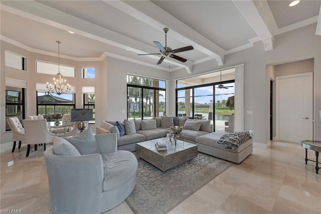 4347 Avalon Court Naples, FL 34119 - Photo 5 of 22 a living room with furniture and a large window