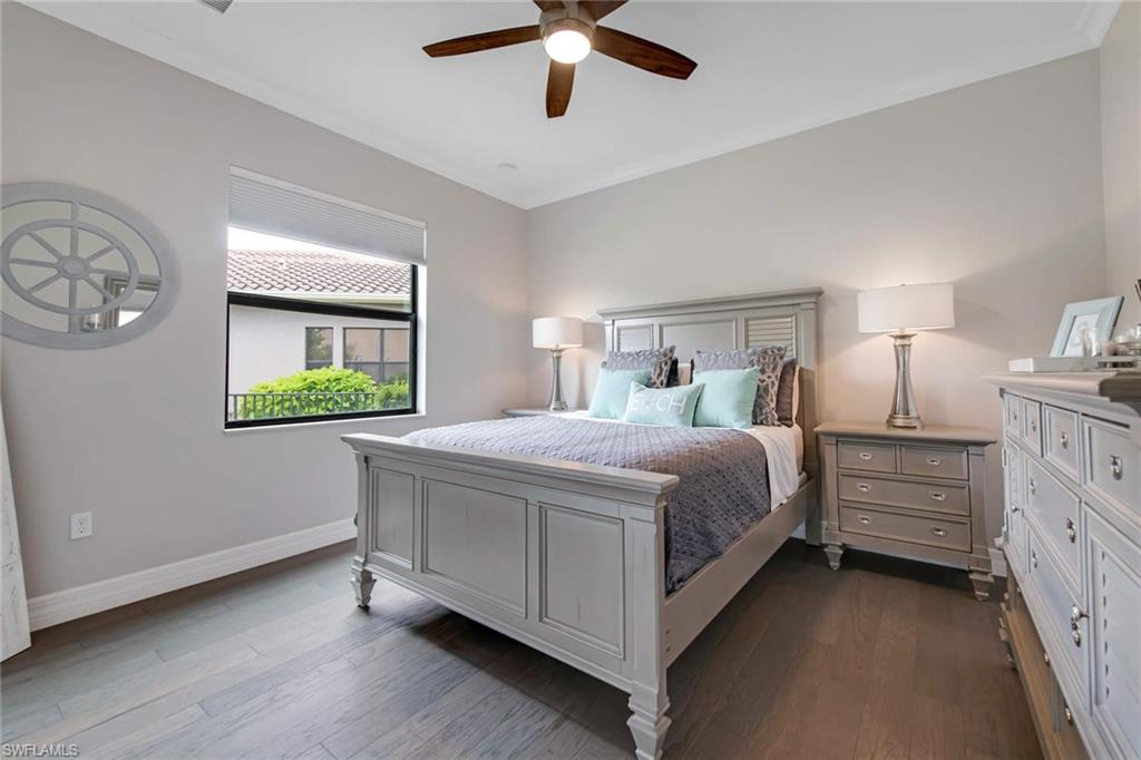 4347 Avalon Court Naples, FL 34119 - Photo 10 of 22 a bed room with a bed and a window
