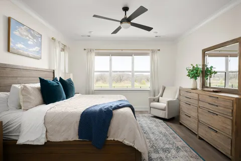 a white bath tub sitting in a bathroom next to a window