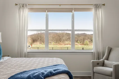 a bath tub sitting in a bathroom next to a window