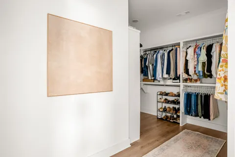 a bedroom with furniture and a window