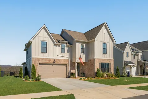 a view of house with yard and entertaining space