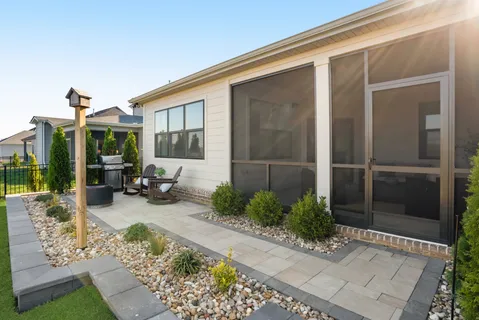 a sign that is in front of flowers