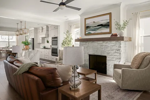a living room with furniture and a fireplace