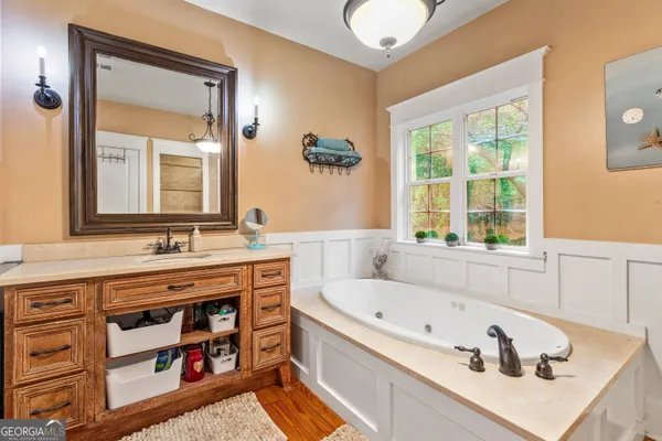 a bathroom with a toilet and shower curtain