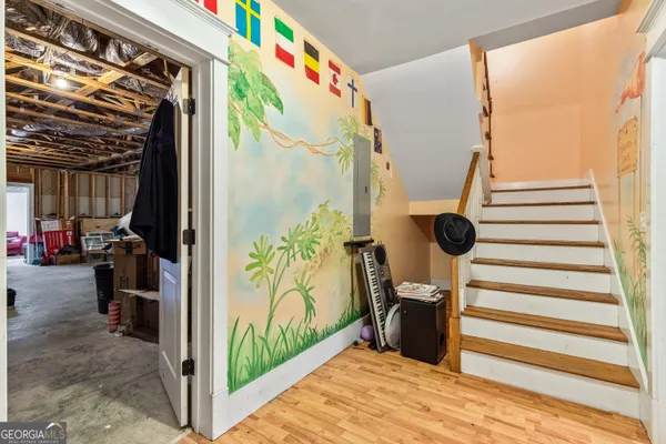 a view of a house with a yard and potted plants