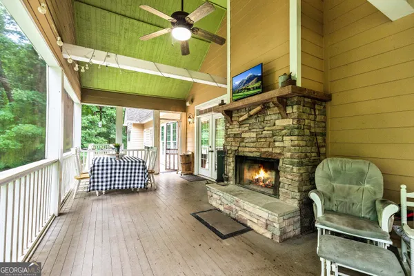 a dining room with furniture and wooden floor