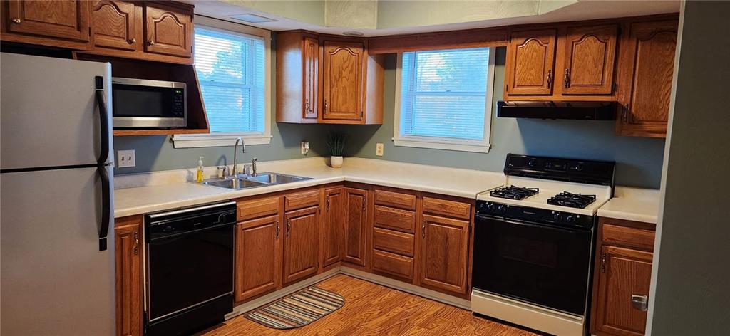 4857 Lucerne Road Indiana, PA 15701 - Photo 4 of 14 a kitchen with granite countertop a stove sink and cabinets