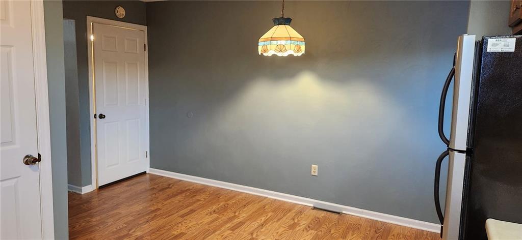 4857 Lucerne Road Indiana, PA 15701 - Photo 6 of 14 a view of empty room with wooden floor and window