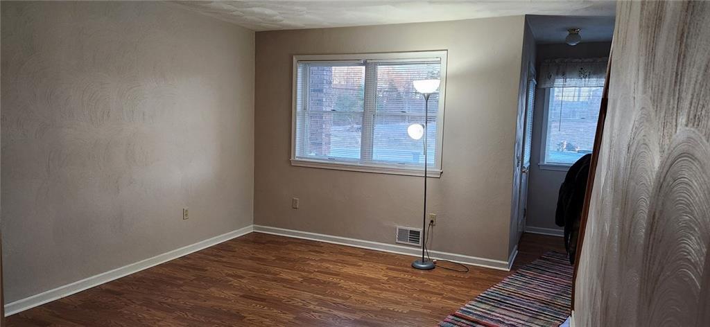 4857 Lucerne Road Indiana, PA 15701 - Photo 7 of 14 an empty room with wooden floor and a window
