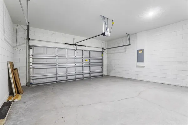 a kitchen with kitchen island a sink stainless steel appliances and cabinets