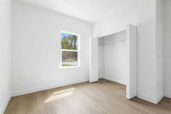 a kitchen with refrigerator a sink and cabinets
