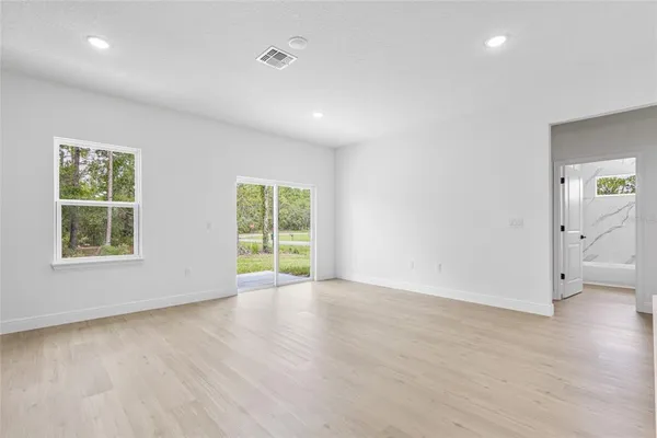 a bedroom with a bed and a potted plant