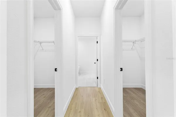 a white toilet sitting next to a white sink