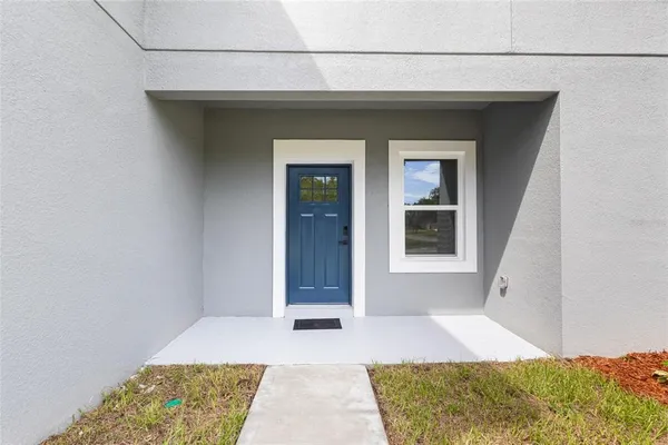 a view of an empty room with closet
