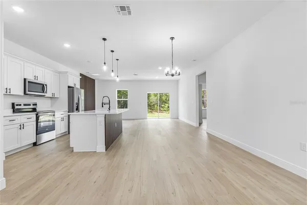 a view of a kitchen with a sink and a window