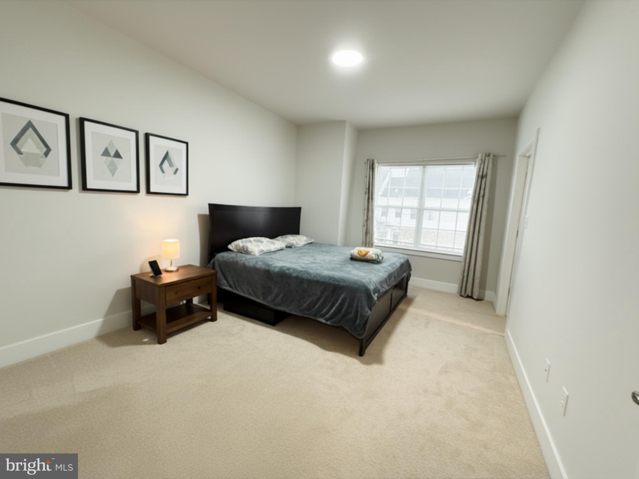 16 Lochiel Lane Exton, PA 19341 - Photo 16 of 19 a bedroom with a bed and a window