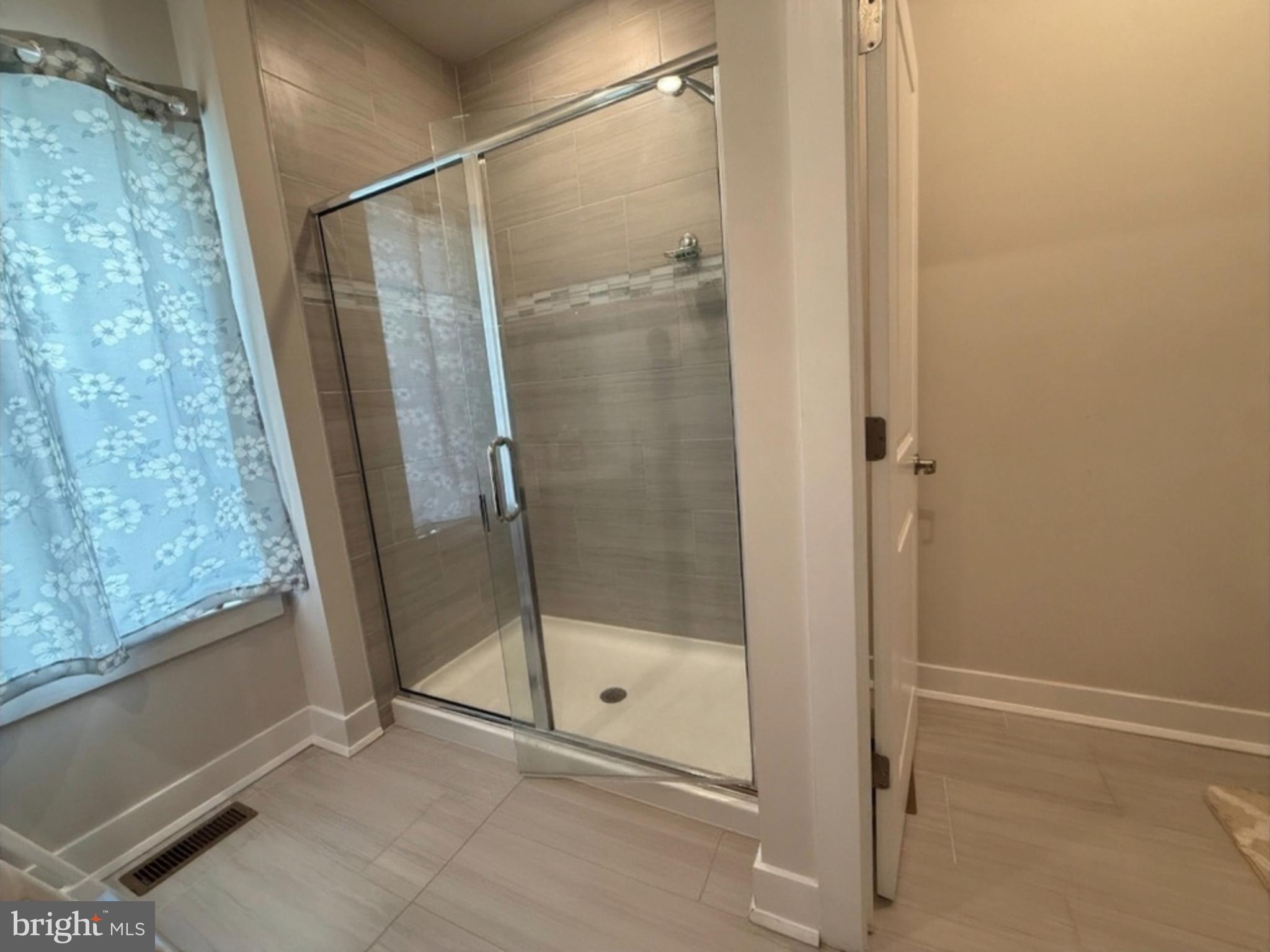 16 Lochiel Lane Exton, PA 19341 - Photo 9 of 19 a bathroom with a glass shower door