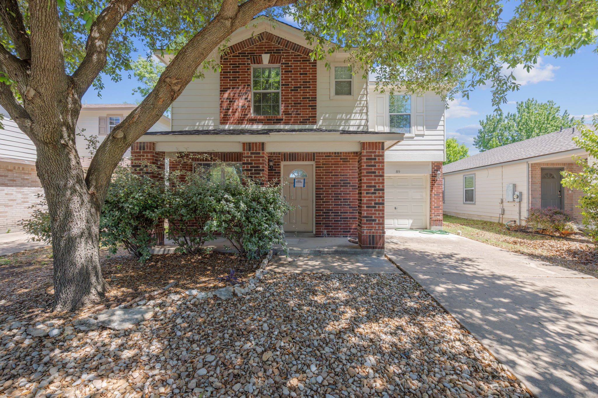 89 Jan Lane Georgetown, TX 78626 - Photo 1 of 29 Traditional-style home with brick siding, concrete driveway, and a garage