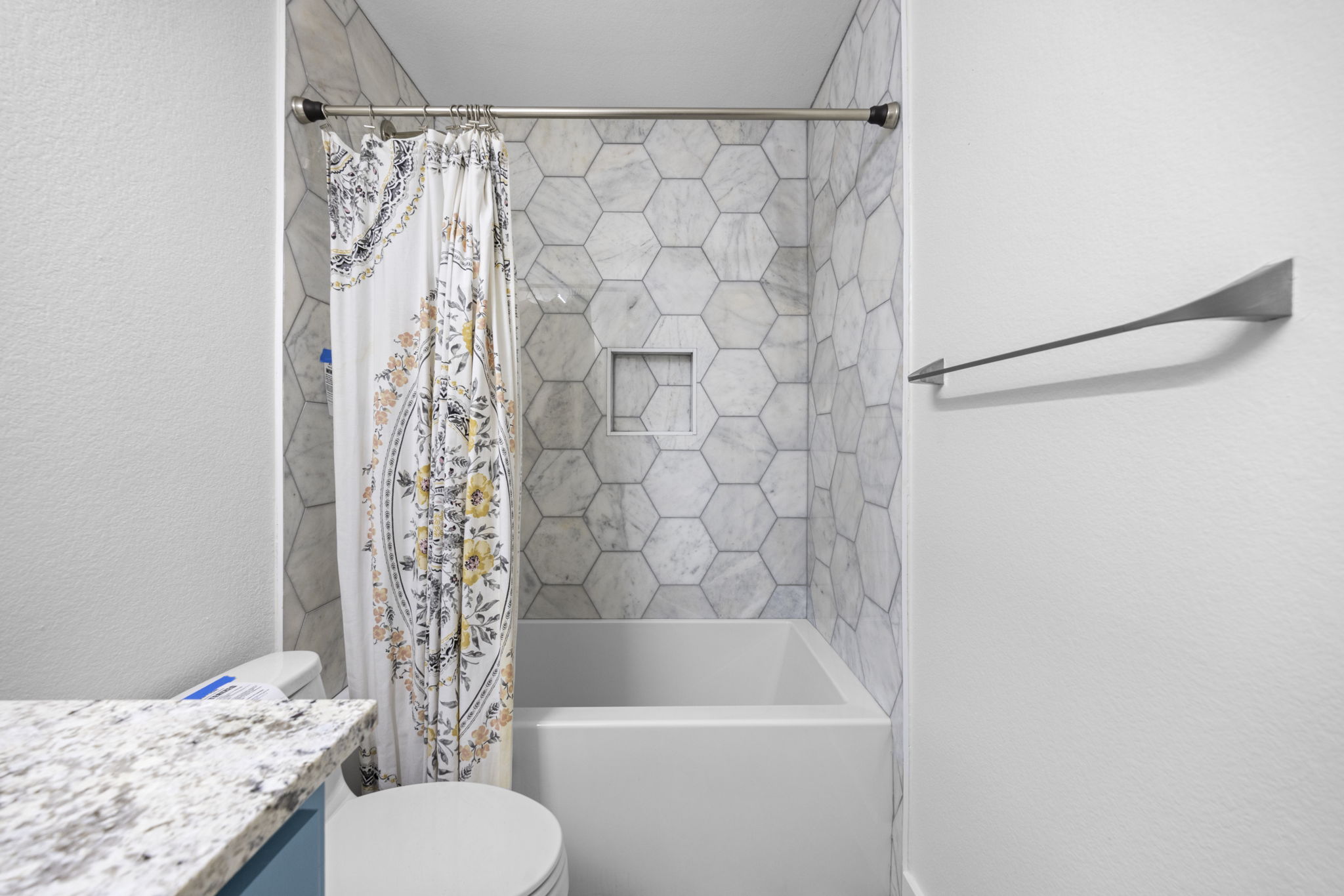 89 Jan Lane Georgetown, TX 78626 - Photo 16 of 29 Full bath featuring vanity, shower / tub combo with curtain, and a textured wall