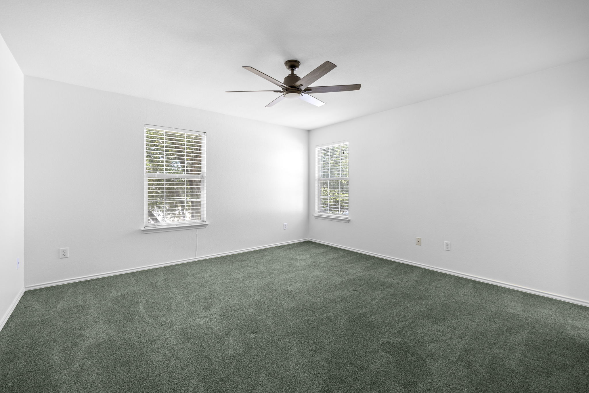 89 Jan Lane Georgetown, TX 78626 - Photo 17 of 29 Spare room featuring a ceiling fan and dark carpet