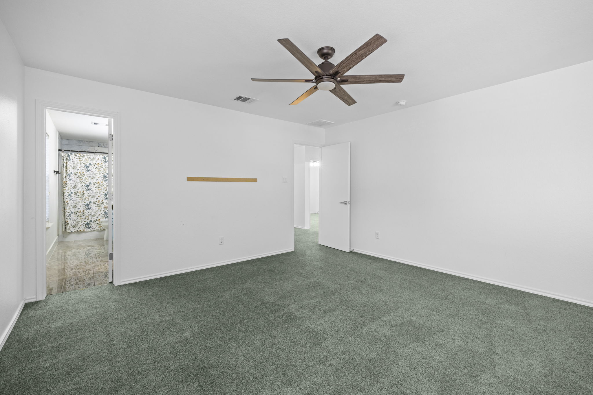 89 Jan Lane Georgetown, TX 78626 - Photo 20 of 29 Unfurnished room featuring dark carpet and ceiling fan