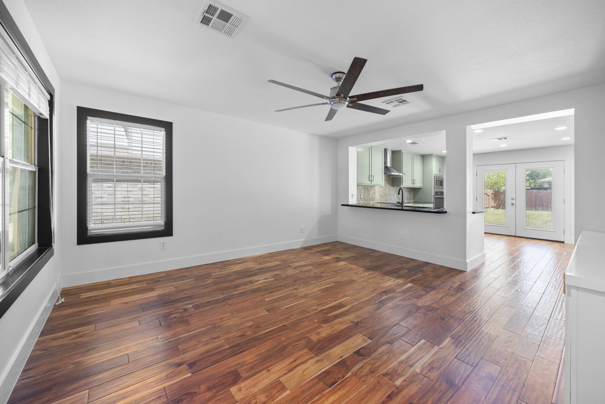 89 Jan Lane Georgetown, TX 78626 - Photo 2 of 29 Unfurnished room with dark wood-style floors, french doors, and a ceiling fan