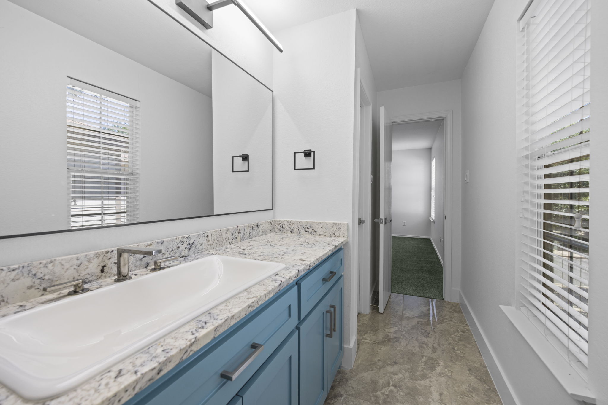 89 Jan Lane Georgetown, TX 78626 - Photo 22 of 29 Bathroom featuring vanity and stone finish flooring